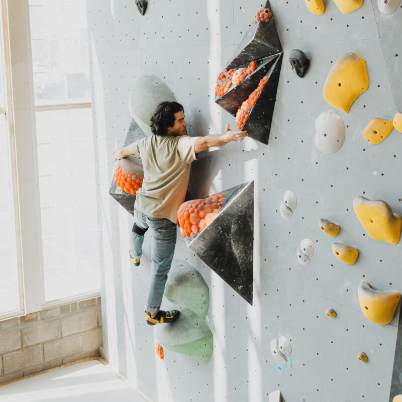 A person boulders at Climb So iLL in St. Charles.